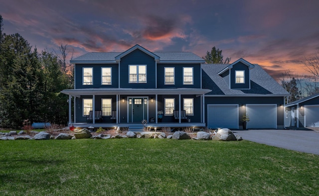 35 Graystone Dr, Hampden, ME 04444 - colonial home featuring an attached garage, a shingled roof, covered porch, a yard, and driveway