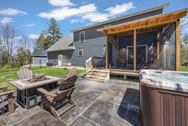 35 Graystone Dr, Hampden, ME 04444 - view of patio / terrace with fence, a hot tub, an outdoor fire pit, and a deck