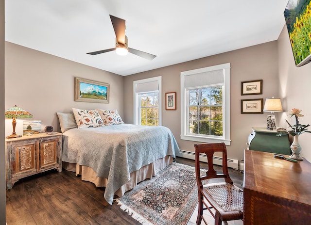 35 Graystone Dr, Hampden, ME 04444 - bedroom with dark wood-style flooring, ceiling fan, and a baseboard heating unit