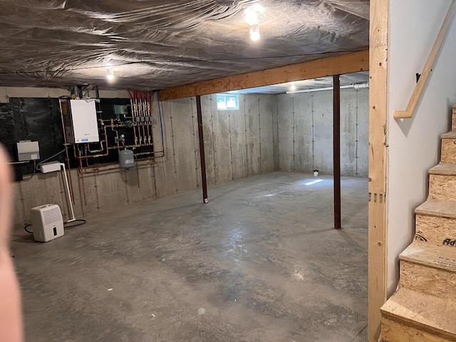 35 Graystone Dr, Hampden, ME 04444 - unfinished basement featuring stairway and tankless water heater