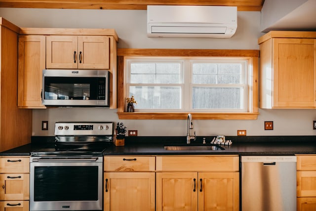 104 Hamlin Rd, Waterford, ME 04088 - kitchen featuring a wall mounted air conditioner, appliances with stainless steel finishes, and light brown cabinets