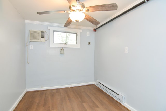 7 Bay Ave Unit 2, Old Orchard Beach, ME 04064 - unfurnished room with a baseboard heating unit, baseboards, a ceiling fan, wood finished floors, and ornamental molding