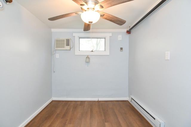 7 Bay Ave Unit 2, Old Orchard Beach, ME 04064 - spare room featuring a baseboard heating unit, a wall mounted AC, dark wood-type flooring, baseboards, and ceiling fan