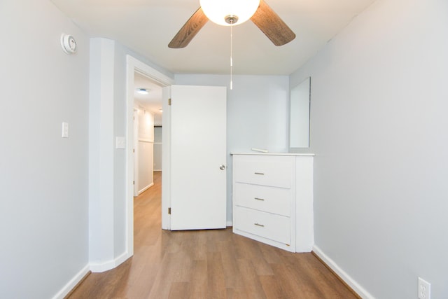 7 Bay Ave Unit 2, Old Orchard Beach, ME 04064 - unfurnished bedroom with wood finished floors, baseboards, and ceiling fan