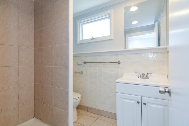 7 Bay Ave Unit 2, Old Orchard Beach, ME 04064 - full bathroom featuring tile patterned flooring, toilet, vanity, tile walls, and a tile shower