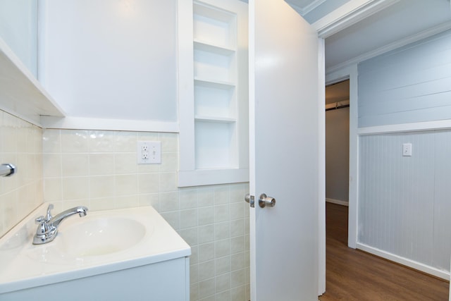 7 Bay Ave Unit 2, Old Orchard Beach, ME 04064 - bathroom featuring wood finished floors, vanity, baseboards, and built in shelves