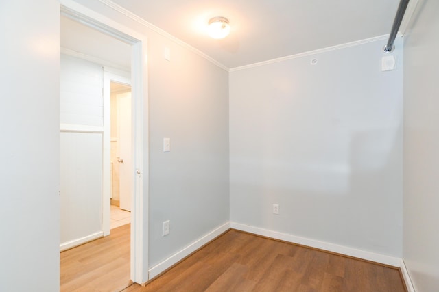 7 Bay Ave Unit 2, Old Orchard Beach, ME 04064 - unfurnished room featuring light wood-style floors, crown molding, and baseboards