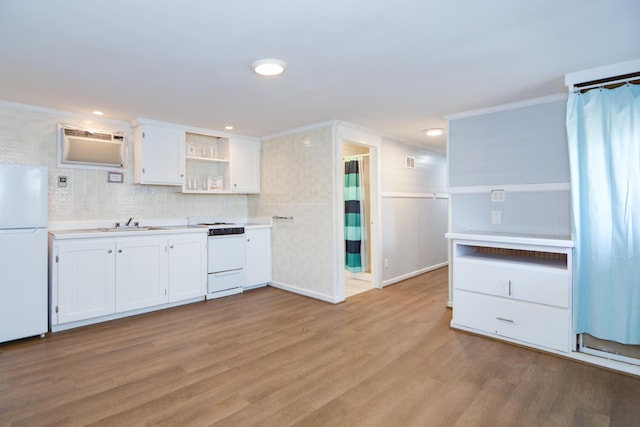 7 Bay Ave Unit 2, Old Orchard Beach, ME 04064 - kitchen with white appliances, open shelves, crown molding, an AC wall unit, and white cabinets