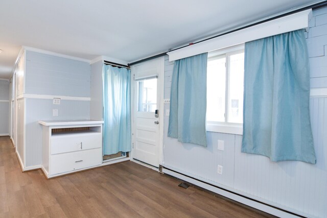 7 Bay Ave Unit 2, Old Orchard Beach, ME 04064 - spare room featuring a baseboard heating unit and dark wood-style flooring