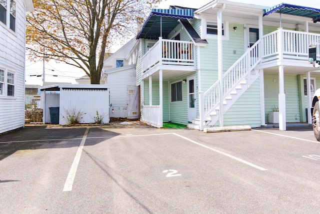 7 Bay Ave Unit 2, Old Orchard Beach, ME 04064 - view of building exterior featuring uncovered parking and stairs