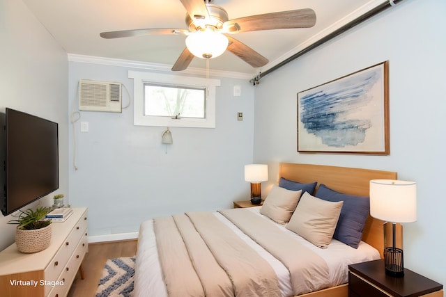 7 Bay Ave Unit 2, Old Orchard Beach, ME 04064 - bedroom with wood finished floors, ornamental molding, a wall mounted air conditioner, a ceiling fan, and baseboards