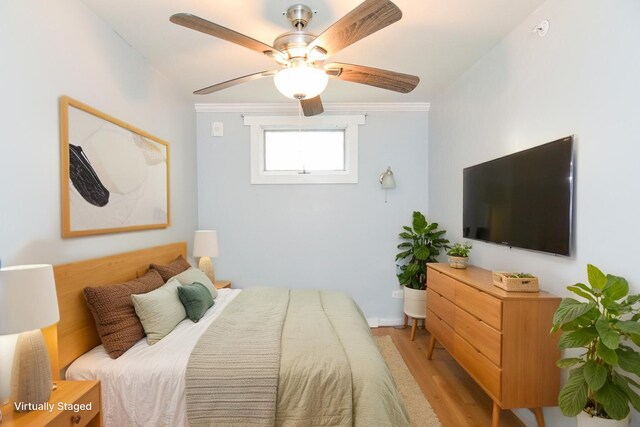 7 Bay Ave Unit 2, Old Orchard Beach, ME 04064 - bedroom with light wood-type flooring, crown molding, ceiling fan, and baseboards