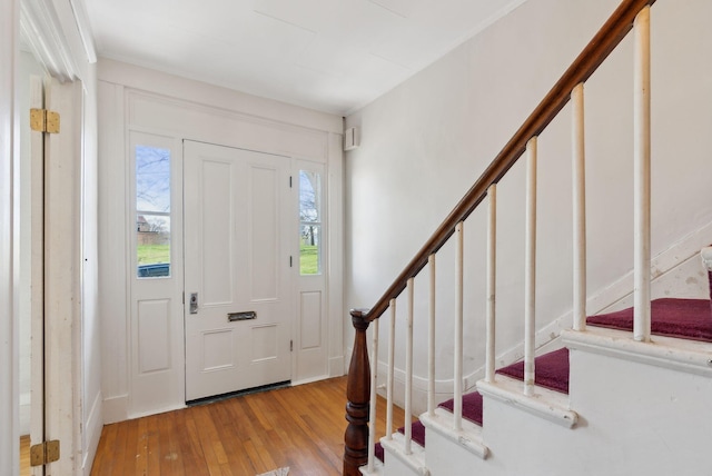11 Linden St, Bath, ME 04530 - foyer with stairs, a wealth of natural light, and hardwood / wood-style floors