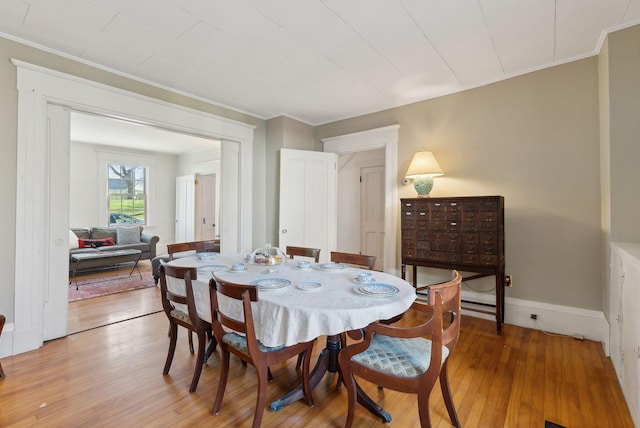 11 Linden St, Bath, ME 04530 - dining space with baseboards, ornamental molding, and light wood-style floors