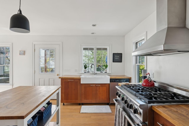 11 Linden St, Bath, ME 04530 - kitchen featuring a sink, wood counters, wall chimney exhaust hood, high end stove, and light wood-style floors