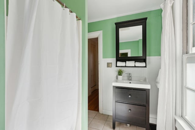 11 Linden St, Bath, ME 04530 - bathroom with ornamental molding, tile patterned floors, vanity, and a wainscoted wall