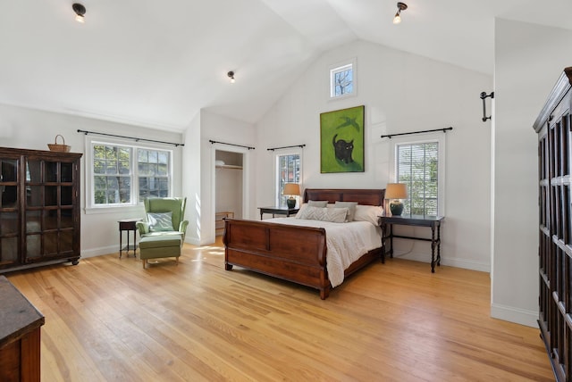 11 Linden St, Bath, ME 04530 - bedroom featuring multiple windows, light wood-style floors, baseboards, and high vaulted ceiling