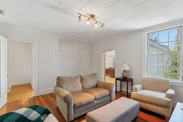 11 Linden St, Bath, ME 04530 - living room featuring ornamental molding, baseboards, visible vents, and wood finished floors