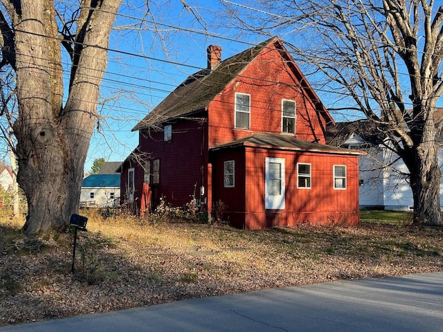 view of front of home with a chimney