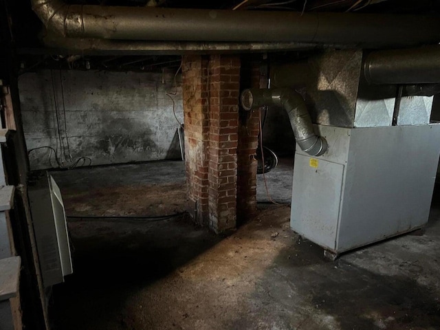 unfinished basement with heating unit