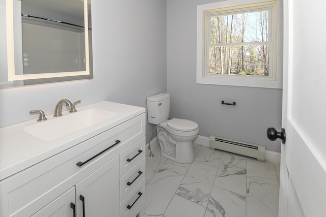 32 Rockwood Dr, Harrison, ME 04040 - bathroom featuring vanity, toilet, marble finish floor, baseboards, and a baseboard radiator