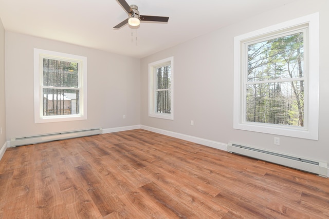 32 Rockwood Dr, Harrison, ME 04040 - spare room featuring baseboard heating and a wealth of natural light