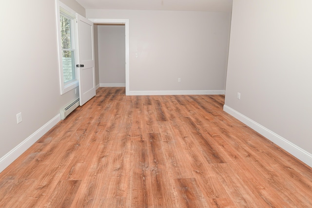 32 Rockwood Dr, Harrison, ME 04040 - spare room featuring baseboards, baseboard heating, and light wood-style flooring