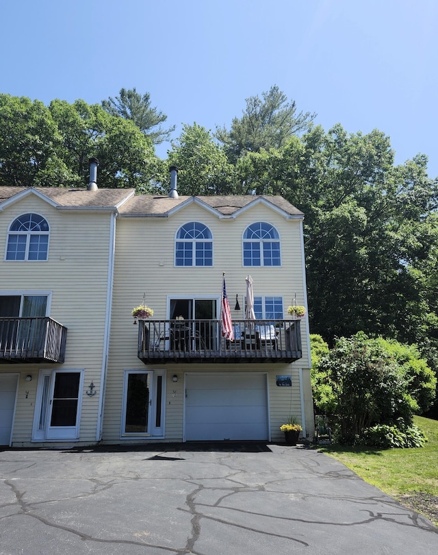 56 Hydrangea Cir Unit 10, Naples, ME 04055 - view of front of home with an attached garage, a balcony, and driveway