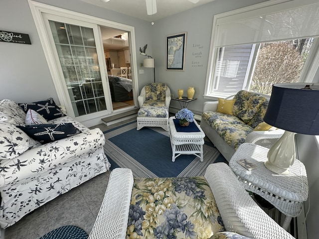 living area with a ceiling fan