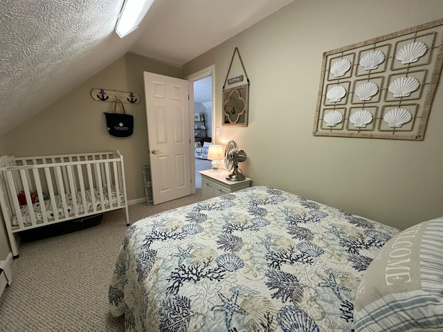 bedroom featuring baseboards, carpet, and vaulted ceiling
