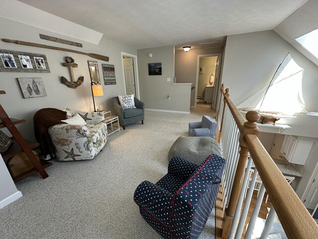 interior space with carpet floors, baseboards, and lofted ceiling