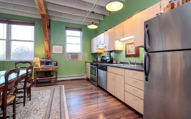 kitchen featuring under cabinet range hood, a baseboard heating unit, beamed ceiling, dark countertops, and appliances with stainless steel finishes