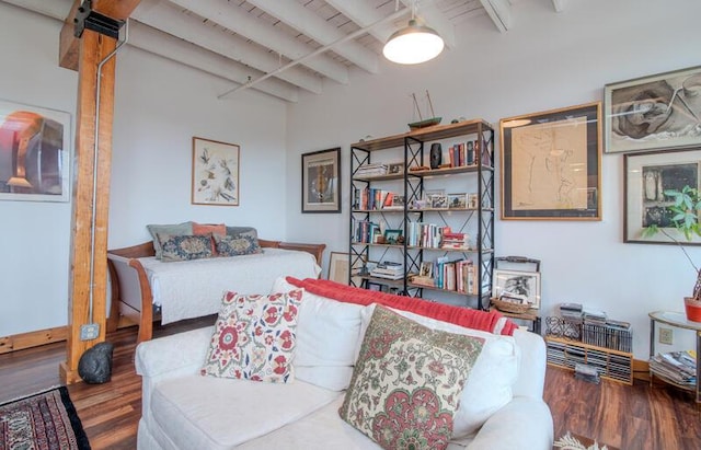 interior space with wood finished floors and beamed ceiling