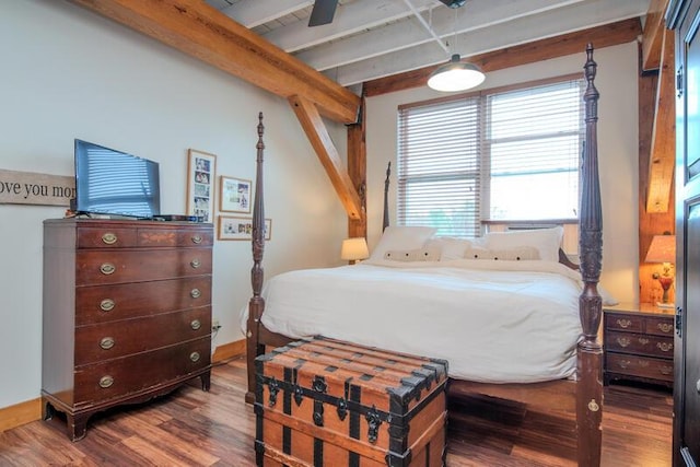 bedroom featuring a ceiling fan, wood finished floors, baseboards, and beamed ceiling