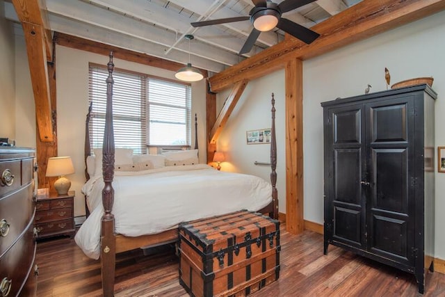 bedroom with baseboards, a baseboard radiator, and wood finished floors
