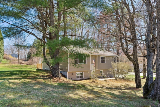 view of side of property featuring a lawn