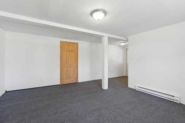 basement with dark carpet and a baseboard heating unit