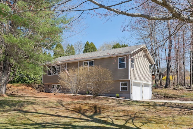 view of side of home with a garage