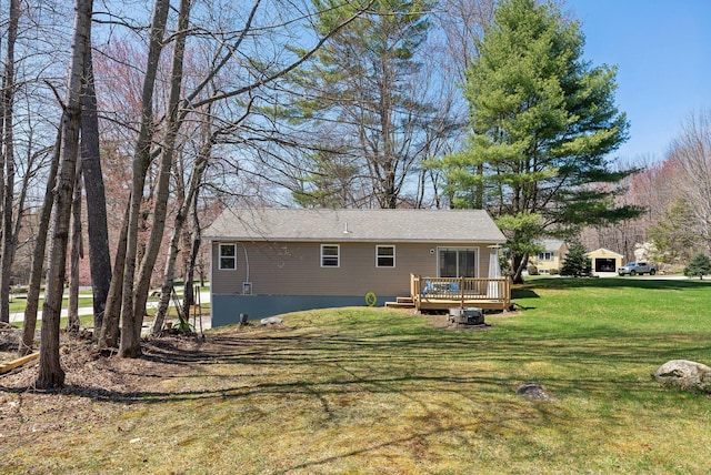 back of house with a yard and a deck