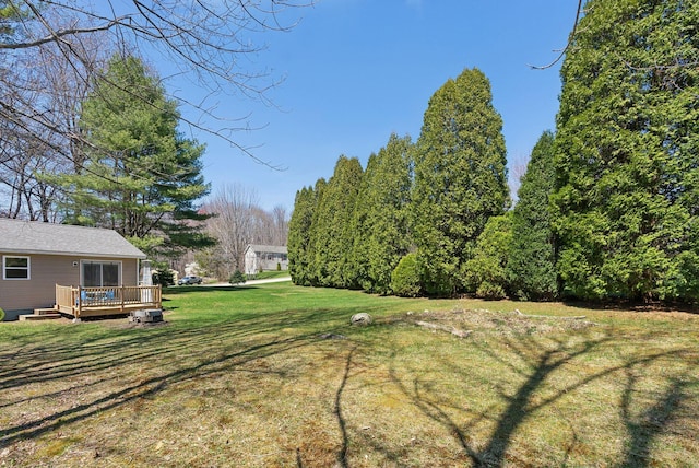view of yard with a deck