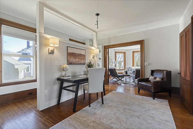 office featuring baseboards, ornamental molding, and hardwood / wood-style floors