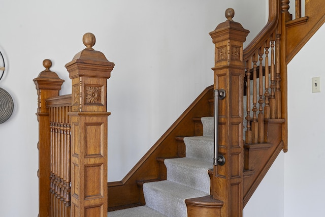 stairs featuring carpet