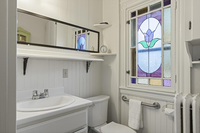 half bath with vanity and toilet