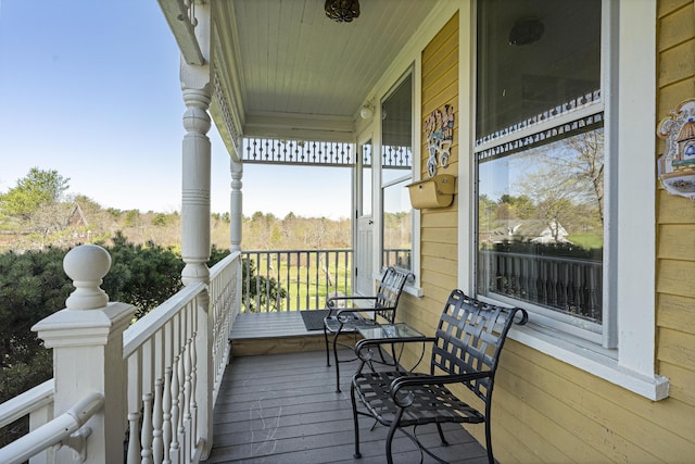 wooden deck featuring covered porch