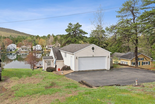 30 Swan Cir, Shapleigh, ME 04076 - view of front of home featuring a residential view, an outbuilding, and asphalt driveway