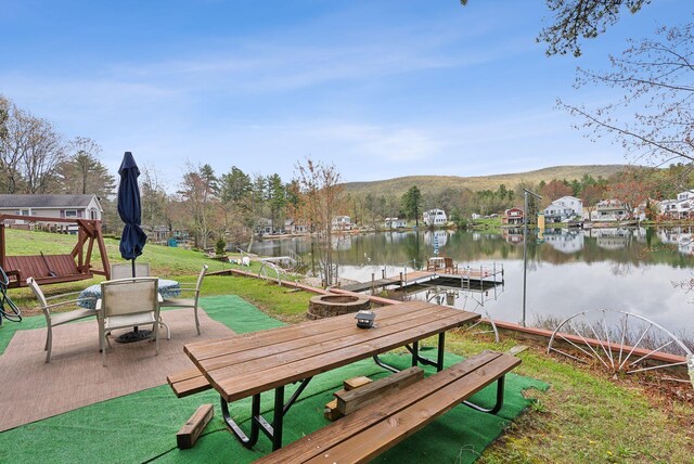 30 Swan Cir, Shapleigh, ME 04076 - view of home's community with outdoor dining space, a water and mountain view, a boat dock, a patio area, and a yard