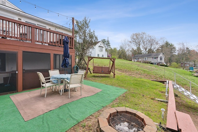 30 Swan Cir, Shapleigh, ME 04076 - view of green lawn featuring an outdoor fire pit, a patio area, and a deck