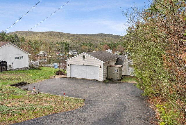 30 Swan Cir, Shapleigh, ME 04076 - garage featuring asphalt driveway and a mountain view