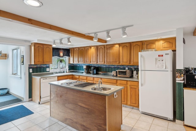 30 Swan Cir, Shapleigh, ME 04076 - kitchen featuring white appliances, rail lighting, an island with sink, and backsplash