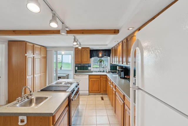 30 Swan Cir, Shapleigh, ME 04076 - kitchen featuring white appliances, a sink, light tile patterned floors, and brown cabinetry